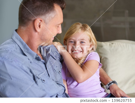 Father, girl and hug in portrait, support and happiness or love in childhood by single parent at home. Daughter, daddy and together in embrace, trust and bonding or security and connection on couch Father, girl and hug in portrait, support and happiness or love in childhood by single parent at home. Daughter, daddy and together in embrace, trust and bonding or security and connection on couch 139620755