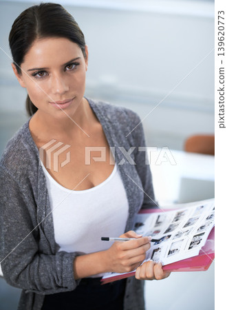 Portrait, editor and woman by contact sheets, confident and creative professional in career in office. Young designer, face or choose image, studio or serious employee in photography agency with pen Portrait, editor and woman by contact sheets, confident and creative professional in career in office. Young designer, face or choose image, studio or serious employee in photography agency with pen 139620773