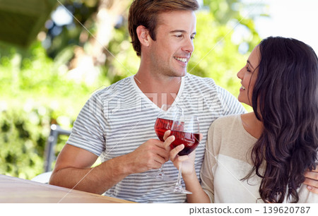 Couple, wine glasses and toast for marriage anniversary, romance and alcohol for celebration in outdoors. Happy people, together and cheers for milestone in relationship, gratitude and support Couple, wine glasses and toast for marriage anniversary, romance and alcohol for celebration in outdoors. Happy people, together and cheers for milestone in relationship, gratitude and support 139620787