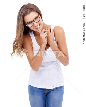 Happy woman, portrait or secret with finger on lips in studio for privacy, confidential surprise or announcement on white background. Model, glasses or quiet emoji for gossip, mystery news or whisper Happy woman, portrait or secret with finger on lips in studio for privacy, confidential surprise or announcement on white background. Model, glasses or quiet emoji for gossip, mystery news or whisper 139620806