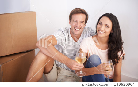 Couple, portrait and wine in new house and celebration with happiness and real estate. Property, glasses with alcohol drink and people moving with boxes excited for future investment and mortgage 139620904