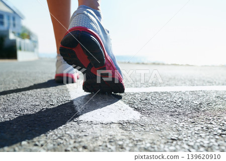 Feet, rear view and running on street for fitness, health or cardio training in preparation or marathon. Sports, exercise and shoes with athlete person on street for workout, performance or race Feet, rear view and running on street for fitness, health or cardio training in preparation or marathon. Sports, exercise and shoes with athlete person on street for workout, performance or race 139620910