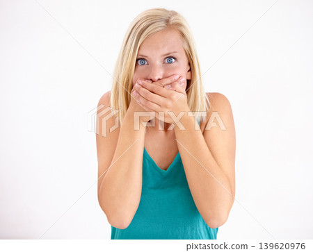 Gossip, portrait and woman cover mouth in surprise for announcement in studio on white background. Wow, shocked and girl with wtf, fake news or omg expression for crazy secret, mistake or drama Gossip, portrait and woman cover mouth in surprise for announcement in studio on white background. Wow, shocked and girl with wtf, fake news or omg expression for crazy secret, mistake or drama 139620976
