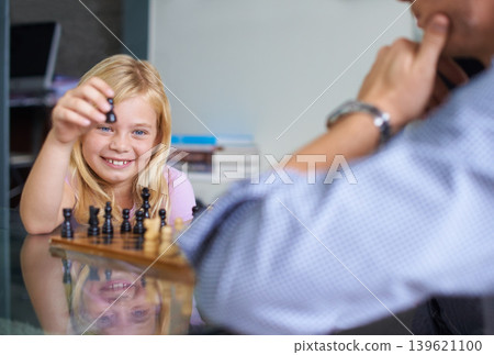 Family, happy and daughter playing chess together in home for strategy development, bonding or fun. Love, growth or board game with parent and girl child learning about competition or challenge Family, happy and daughter playing chess together in home for strategy development, bonding or fun. Love, growth or board game with parent and girl child learning about competition or challenge 139621100