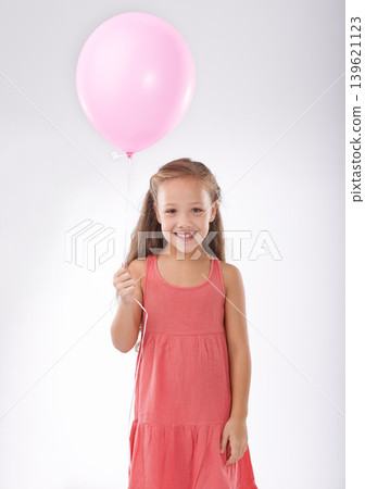 Girl, child and balloon in portrait, party or birthday with decoration for celebration, youth and happiness. Studio, young kid with toys and excited for anniversary with childhood on white background Girl, child and balloon in portrait, party or birthday with decoration for celebration, youth and happiness. Studio, young kid with toys and excited for anniversary with childhood on white background 139621123