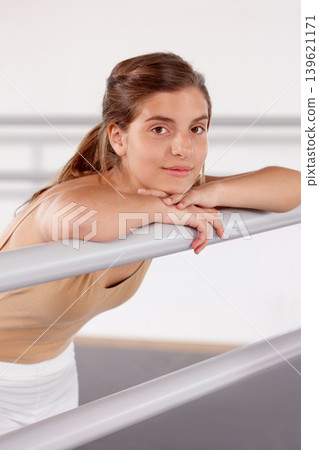Portrait, ballerina and girl on barre in studio, practice and student exercise in academy. Ballet, young teenager and training, dance choreography for art or performance for body fitness at school Portrait, ballerina and girl on barre in studio, practice and student exercise in academy. Ballet, young teenager and training, dance choreography for art or performance for body fitness at school 139621171