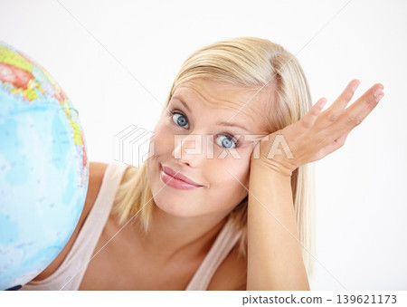 Woman, travel choice and globe with portrait and happy from earth day, holiday or international vacation. Smile, world and map for decision and idea with a female person and embrace of the planet 139621173