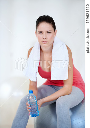 Ball, portrait or woman drinking water to relax after exercise, workout or fitness training on gym break. Fatigue, tired or thirsty sports athlete with liquid bottle for wellness, rest or hydration Ball, portrait or woman drinking water to relax after exercise, workout or fitness training on gym break. Fatigue, tired or thirsty sports athlete with liquid bottle for wellness, rest or hydration 139621310