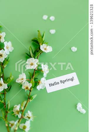fresh spring flowers with greeting label on soft green background fresh spring flowers with greeting label on soft green background 139621328