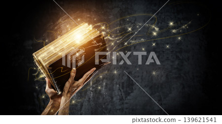 Opening a magical antique book                  139621541