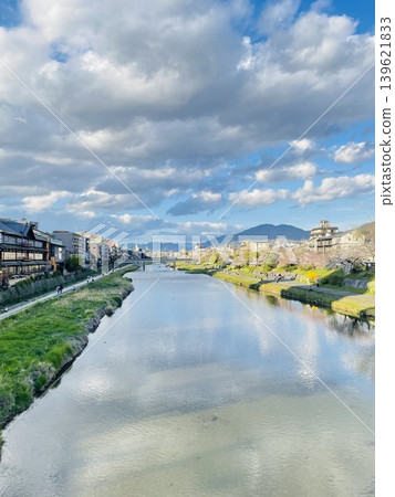 The Kamo River in spring: A scene of calm waters and a blue sky. The Kamo River in spring: A scene of calm waters and a blue sky. 139621833