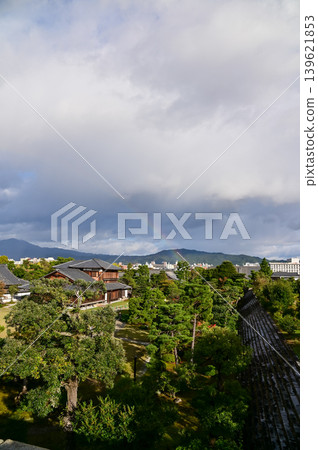 Rainbow on the sky from the view of nijo jo castle, Kyoto, Japan. World Heritage Site. Major tourist attraction in Kansai region in Japan. Japan famous historic architecture. Nature scene. Rainbow on the sky from the view of nijo jo castle, Kyoto, Japan. World Heritage Site. Major tourist attraction in Kansai region in Japan. Japan famous historic architecture. Nature scene. 139621853