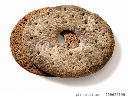 Finnish ring shaped rye bread on white background Finnish ring shaped rye bread on white background 139622196