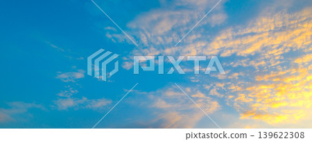 Sunset Sky with Vibrant Blue and Yellow Clouds 139622308