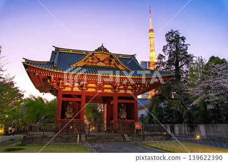 The former main gate of Taitokuin Mausoleum and Tokyo Tower, illuminated in the magic hour sky in Minato Ward, Tokyo. The former main gate of Taitokuin Mausoleum and Tokyo Tower, illuminated in the magic hour sky in Minato Ward, Tokyo. 139622390