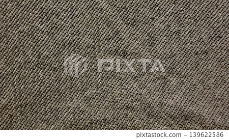brown tweed fabric texture closeup with diagonal weave pattern evoking rustic warmth and earthy depth for design inspiration 139622586