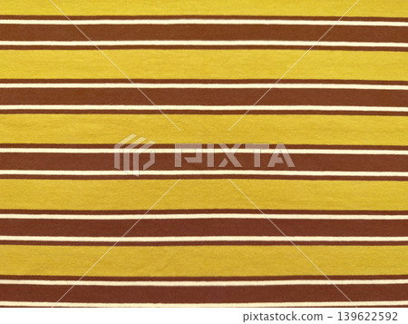 striped mustard yellow chocolate brown fabric texture with fine white accents in retro horizontal pattern closeup striped mustard yellow chocolate brown fabric texture with fine white accents in retro horizontal pattern closeup 139622592