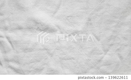 wrinkled light gray cotton fabric texture closeup showcasing soft creases and subtle shadows in minimalist neutral palette for serene design backgrounds wrinkled light gray cotton fabric texture closeup showcasing soft creases and subtle shadows in minimalist neutral palette for serene design backgrounds 139622611