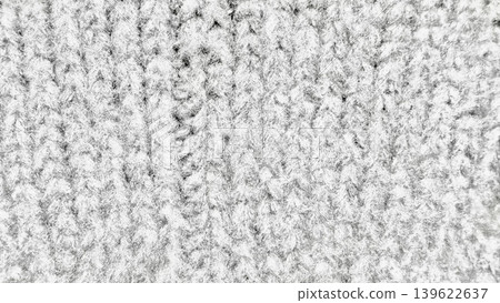closeup textured knit wool fabric in grayscale evoking cozy winter tactile warmth and abstract pattern for design backgrounds closeup textured knit wool fabric in grayscale evoking cozy winter tactile warmth and abstract pattern for design backgrounds 139622637