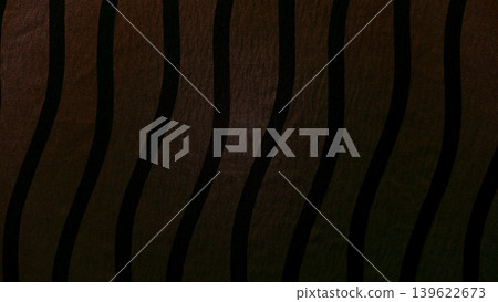 sinuous black waves rippling over deep brown textured fabric abstract background sinuous black waves rippling over deep brown textured fabric abstract background 139622673