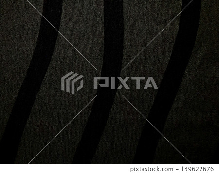 closeup black striped fabric texture with subtle sheen and woven details 139622676