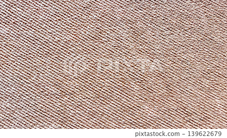 intricately twisted beige rope texture closeup revealing diagonal braid weave for rustic natural fiber background 139622679