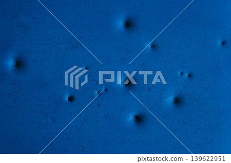 Dents pattern holes bullet shot marks metal surface old background iron texture steel gun blue 139622951