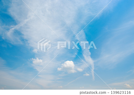 Beautiful Blue Sky with Soft White Clouds and Airplane Vapor Trail Beautiful Blue Sky with Soft White Clouds and Airplane Vapor Trail 139623116