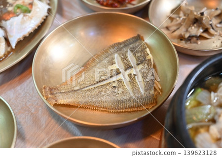 Pan Fried Flounder Served in Traditional Korean Brass Bowl Pan Fried Flounder Served in Traditional Korean Brass Bowl 139623128