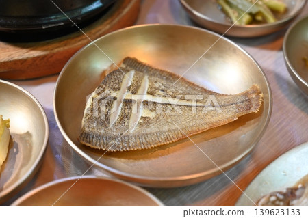 Pan Fried Flounder Served in Traditional Korean Brass Bowl Pan Fried Flounder Served in Traditional Korean Brass Bowl 139623133