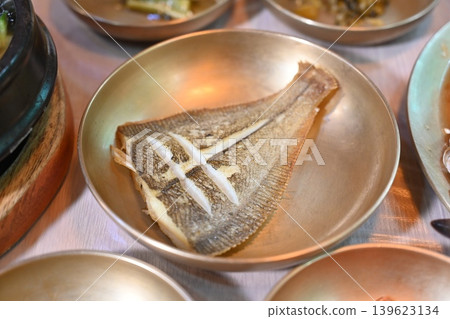 Pan Fried Flounder Served in Traditional Korean Brass Bowl Pan Fried Flounder Served in Traditional Korean Brass Bowl 139623134