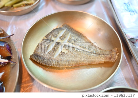 Pan Fried Flounder Served in Traditional Korean Brass Bowl Pan Fried Flounder Served in Traditional Korean Brass Bowl 139623137