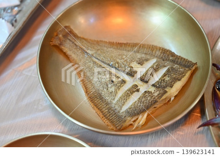 Pan Fried Flounder Served in Traditional Korean Brass Bowl Pan Fried Flounder Served in Traditional Korean Brass Bowl 139623141