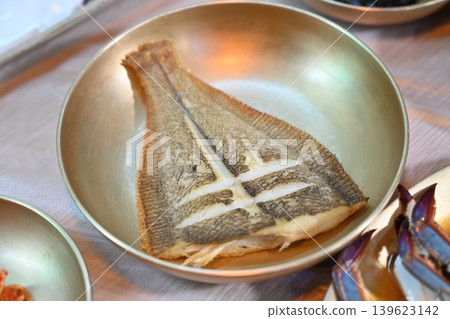 Pan Fried Flounder Served in Traditional Korean Brass Bowl Pan Fried Flounder Served in Traditional Korean Brass Bowl 139623142