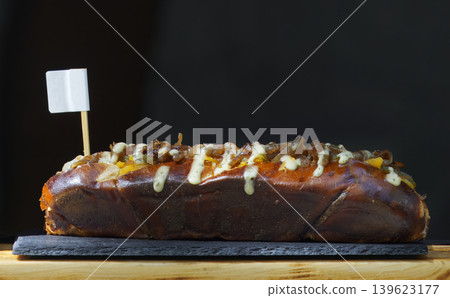 Gourmet pork rib pretzel baguette at street food festival Gourmet pork rib pretzel baguette at street food festival 139623177