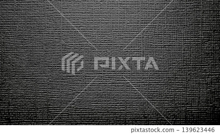 dark abstract woven texture with intricate geometric grid pattern on rough monochrome surface 139623446