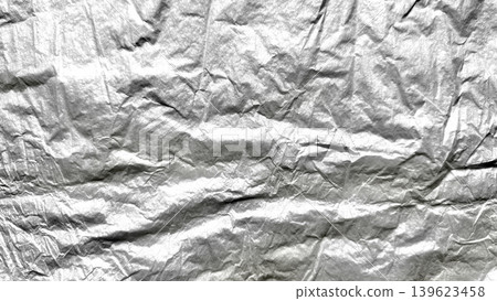 crinkled aluminum foil macro texture shiny silver metallic wrinkles abstract reflective surface closeup 139623458