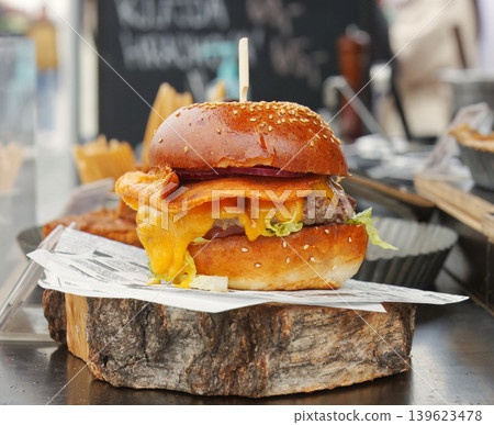Cheeseburger on Wooden Board at Naplavka Market Cheeseburger on Wooden Board at Naplavka Market 139623478