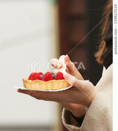 Woman Holding Raspberry Tart at Naplavka Market Woman Holding Raspberry Tart at Naplavka Market 139623526