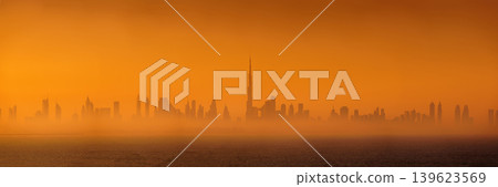 Dubai, United Arab Emirates - Jan 12 2024, Panoramic view of downtown Dubai skyscrapers, with Burj Khalifa in the middle, at dawn in a haze, a view from the sea, Dubai, United Arab Emirates Dubai, United Arab Emirates - Jan 12 2024, Panoramic view of downtown Dubai skyscrapers, with Burj Khalifa in the middle, at dawn in a haze, a view from the sea, Dubai, United Arab Emirates 139623569
