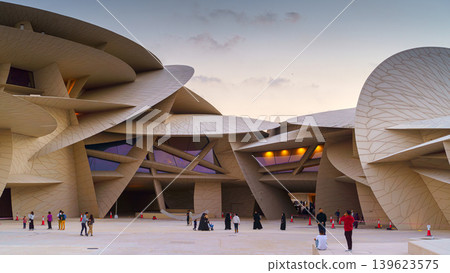 Doha, Qatar - Jan 06 2024, a panoramic view of National Museum of Qatar courtyard, patio, with some people in it, in shape of desert rose, at evening, Doha, Qatar Doha, Qatar - Jan 06 2024, a panoramic view of National Museum of Qatar courtyard, patio, with some people in it, in shape of desert rose, at evening, Doha, Qatar 139623575