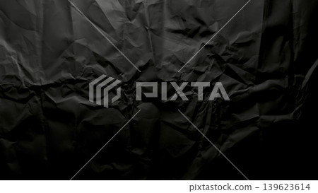 crumpled black paper abstract texture with deep wrinkles intricate folds dramatic shadows moody monochrome crumpled black paper abstract texture with deep wrinkles intricate folds dramatic shadows moody monochrome 139623614