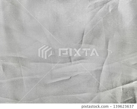 wrinkled fabric fold draped softly casts intricate shadow in serene abstract monochrome composition 139623637