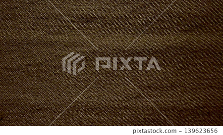 earthy brown twill denim fabric texture macro closeup reveals intricate diagonal weave pattern natural tactile folds earthy brown twill denim fabric texture macro closeup reveals intricate diagonal weave pattern natural tactile folds 139623656