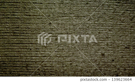 olive green ribbed fabric texture closeup reveals organic sustainable natural fibers in earthy rustic tones 139623664