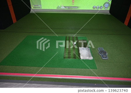 Indoor Golf Simulator Mat with Ball on Tee and Control Panel Indoor Golf Simulator Mat with Ball on Tee and Control Panel 139623740