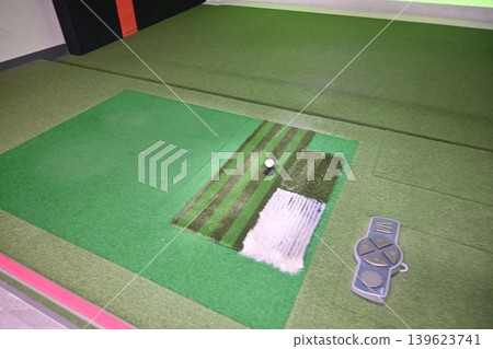 Indoor Golf Simulator Mat with Ball on Tee and Control Panel Indoor Golf Simulator Mat with Ball on Tee and Control Panel 139623741