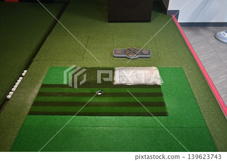 Indoor Golf Simulator Mat with Ball on Tee and Control Panel Indoor Golf Simulator Mat with Ball on Tee and Control Panel 139623743