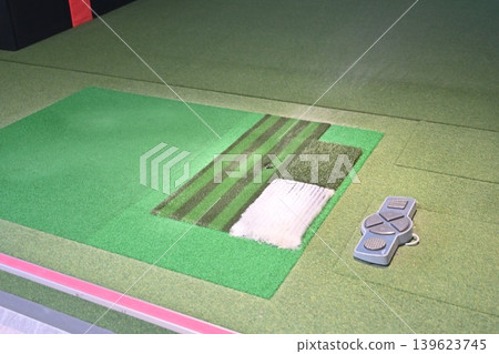 Indoor Golf Simulator Mat with Ball on Tee and Control Panel Indoor Golf Simulator Mat with Ball on Tee and Control Panel 139623745