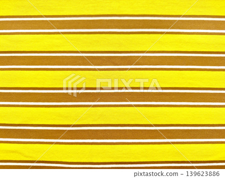 vibrant yellow and mustard brown striped jersey fabric texture with crisp white accents in sharp macro detail vibrant yellow and mustard brown striped jersey fabric texture with crisp white accents in sharp macro detail 139623886